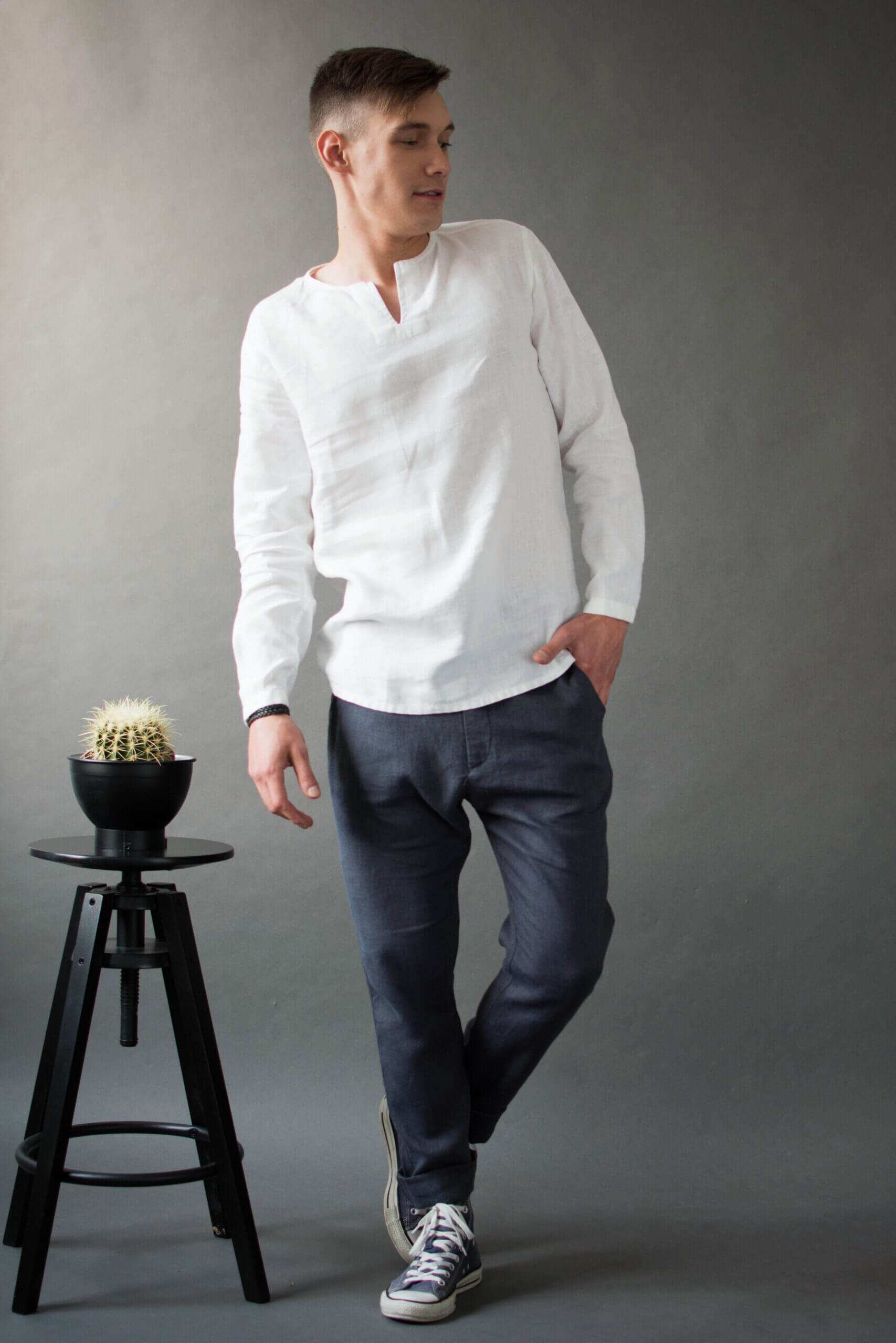 White linen v-neck shirt complemented by graphite chino pants