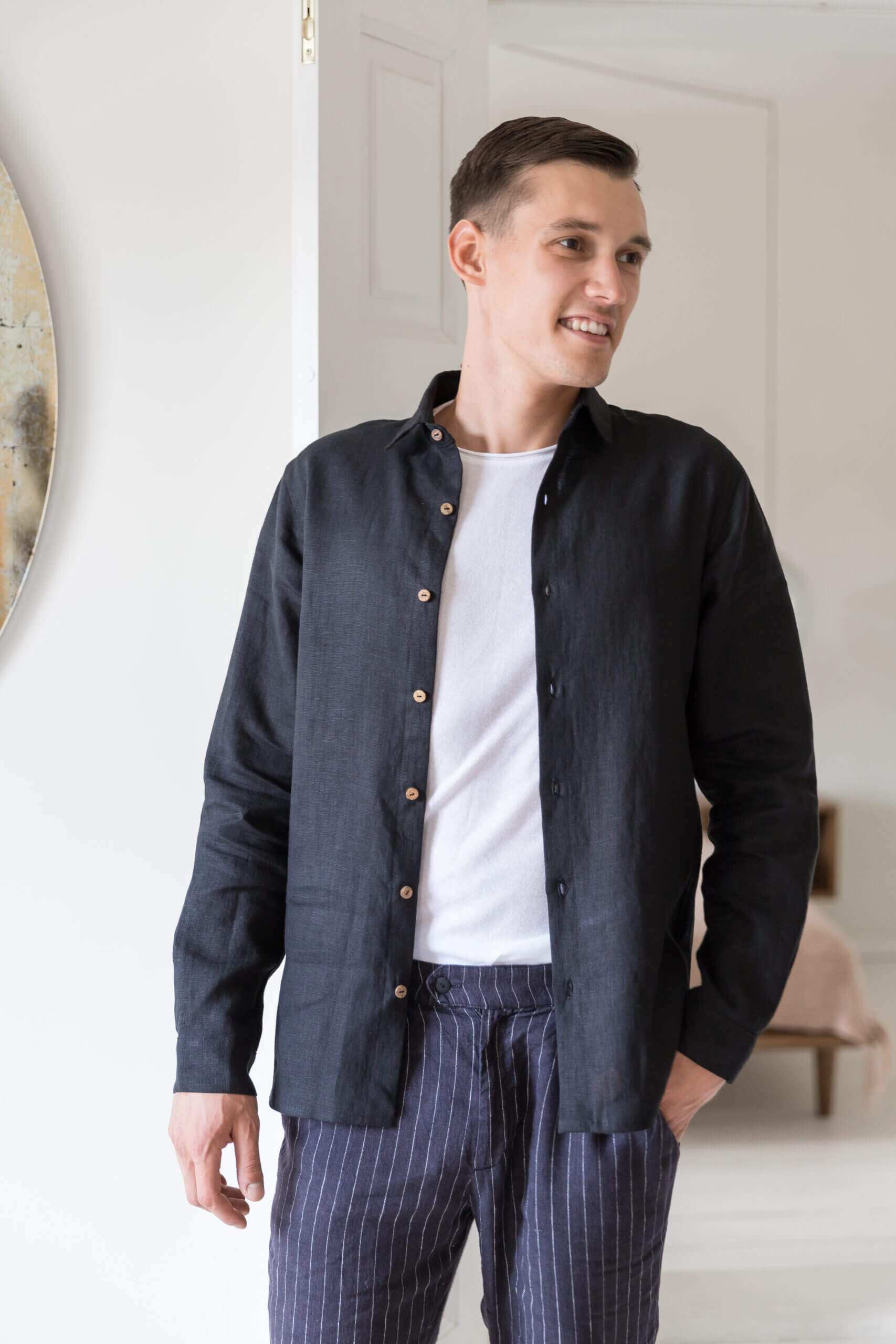 Black linen shirt casually styled with top button open
